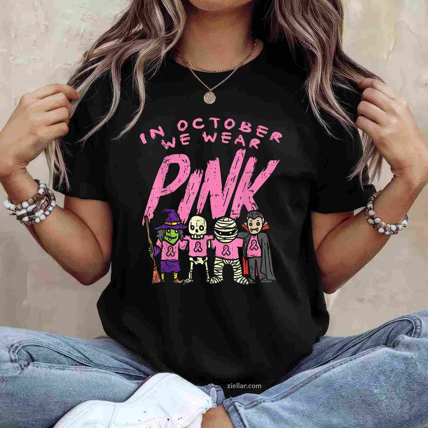 October We Wear Pink Witch Skeleton Halloween Breast Cancer Funny Graphic Tee and T-Shirt Gift for Adults Men Women Unisex